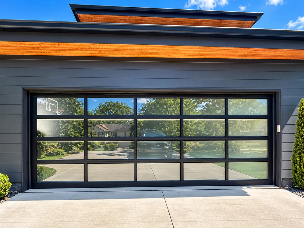 Modern residential garage door with full-view glass panels