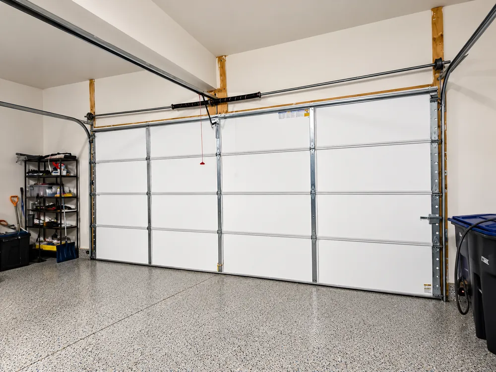 Interior view of a residential sectional garage door and tracks