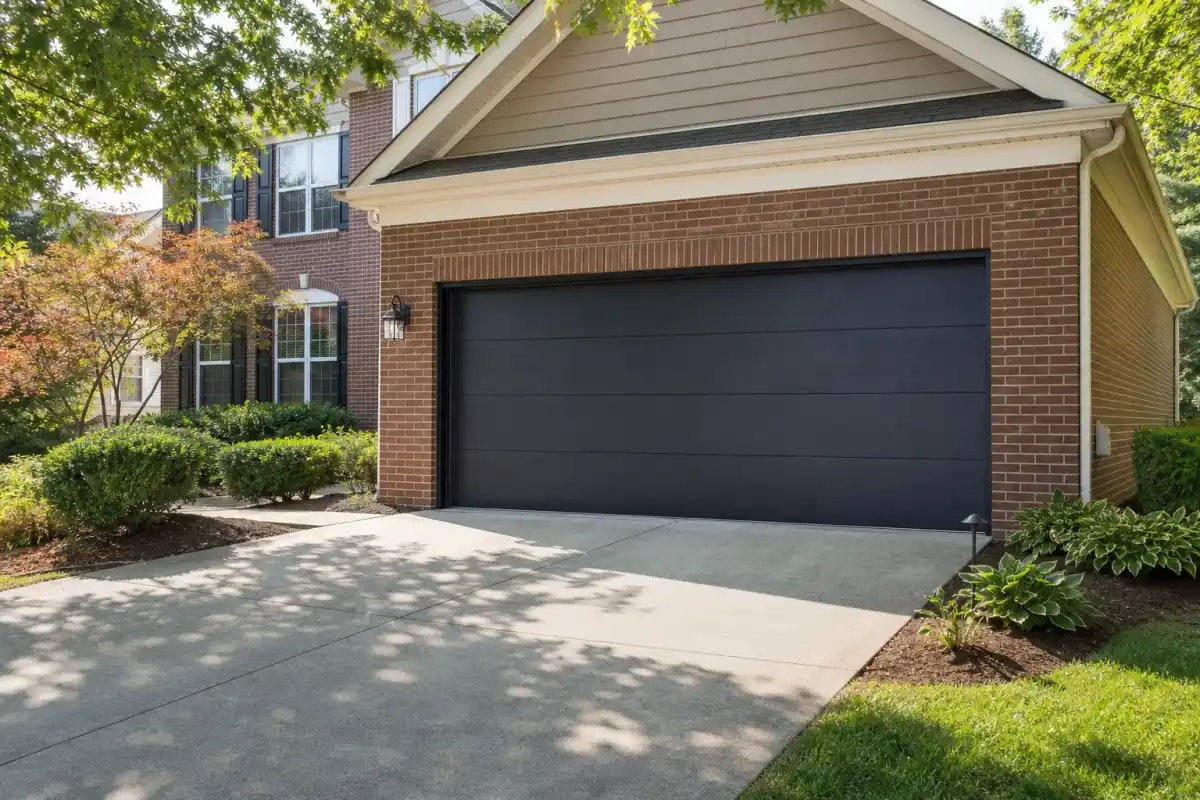 New steel garage door on a brick suburban home in the DC area
