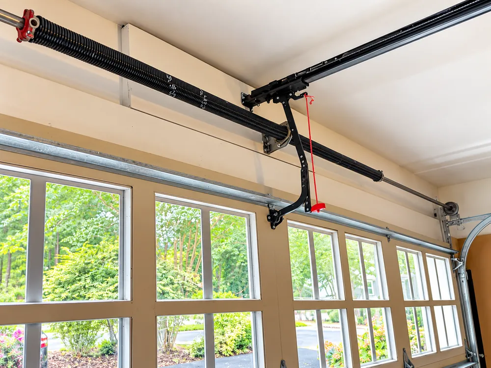 Residential garage door spring and opener mechanism